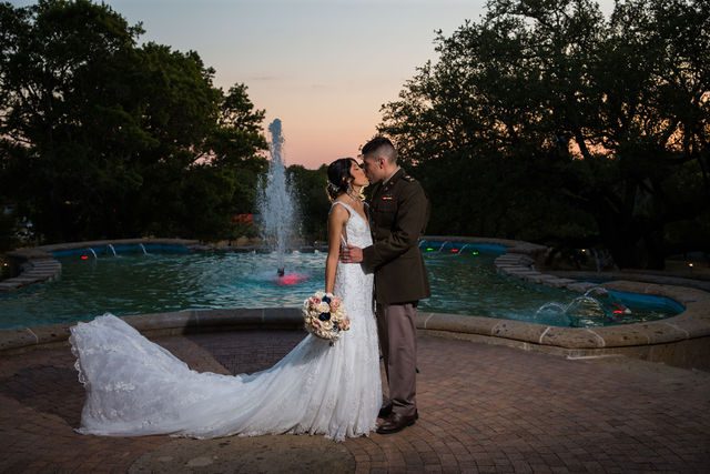 Kylee's wedding at the McNay reception portrait at sunset by fountain