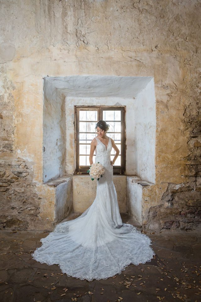 Kylee's bridal at Mission San Jose bride in the window looking down