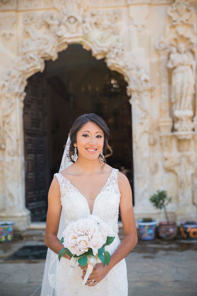 Kylee's bridal at Mission San Jose bride with the chapel doors.