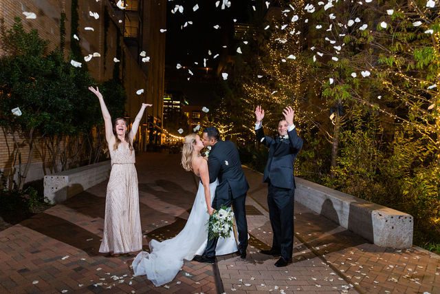 Kelsey wedding at the Hotel Emma in San Antonio bridal party throwing petals