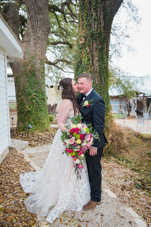 Simon wedding at Gruene Estate in New Braunfels couple's first look kiss