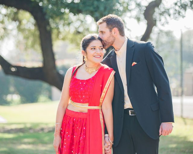 Malini's engagement session couple by the tennis courts holding hands