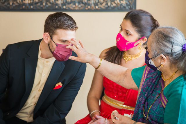 Malini's Hindi engagement ceremony grandmother putting on ash