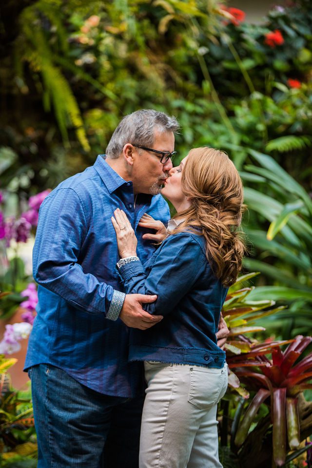 Deborah's engagement at Botanical Gardens in the greenhouse kissing