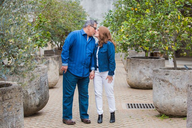 Deborah's engagement at Botanical Gardens couple walking in the orangery kiss