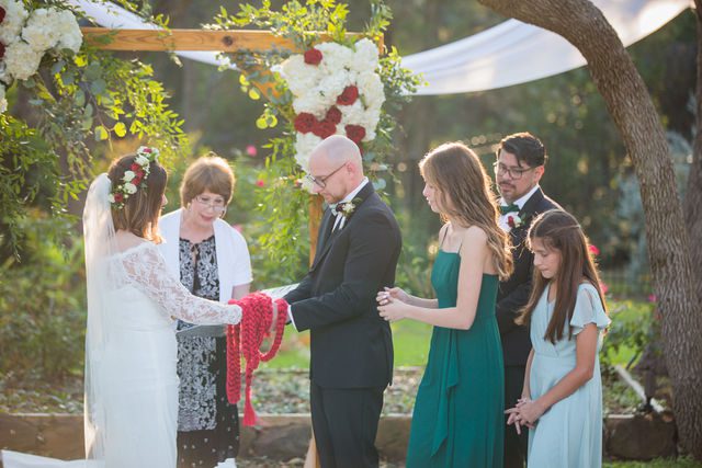 Pixley wedding in Garden Ridge ceremony hand tying ceremony