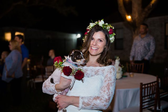 Pixley wedding in Garden Ridge reception bride holding doggies