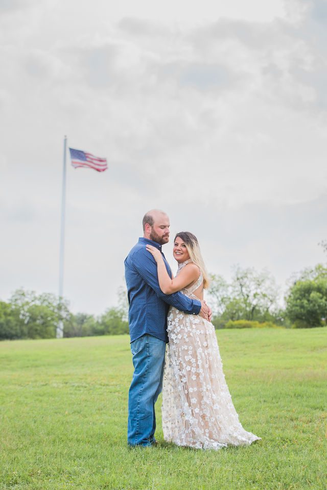 Brittany's engagement at Cypress Bend New Braunfels with the flag