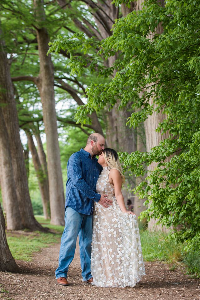 Brittany's engagement portrait at Cypress Bend park kiss in the trees