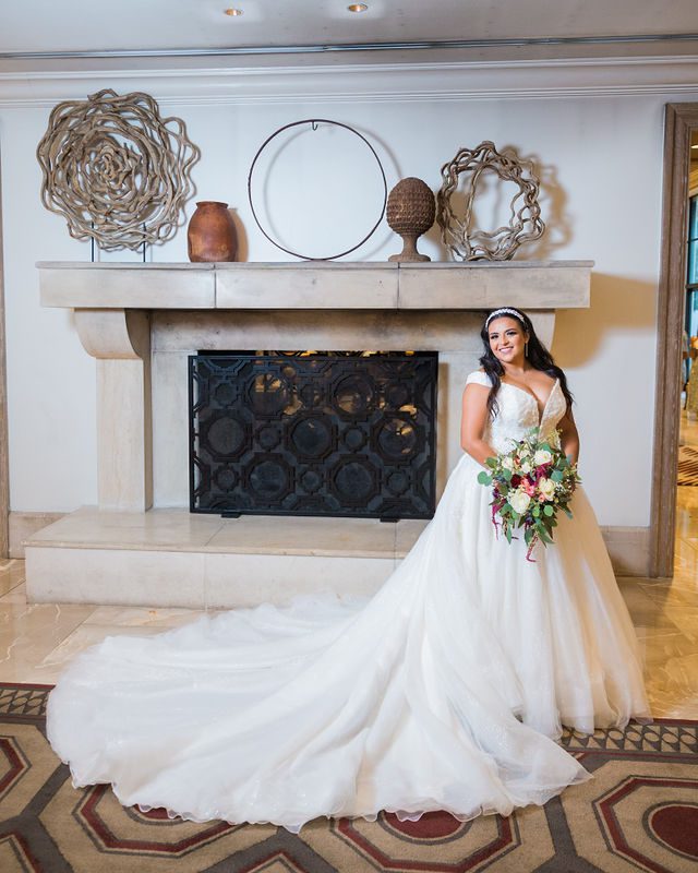 Ebonee's bridal at La Cantera portrait in front of the fireplace