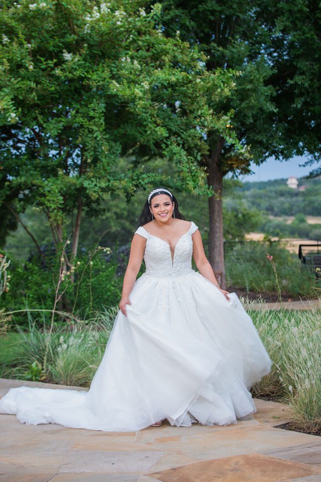 Ebonee's bridal at La Cantera portrait in front of the trees walking