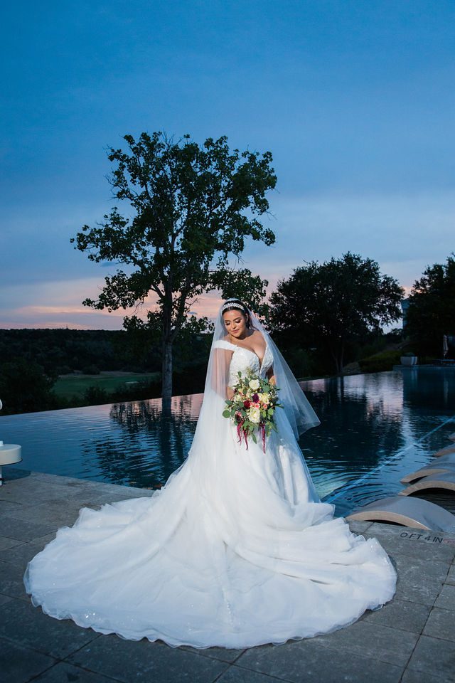 Ebonee's bridal at La Cantera portrait sunset beside the pool