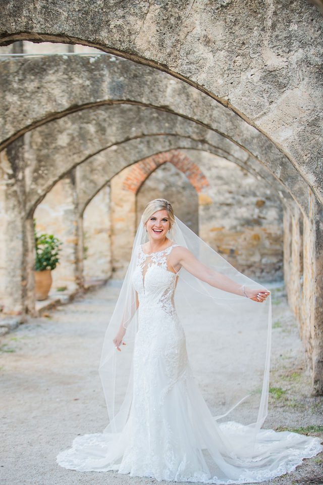 Jennifer's bridal with veil in the arches at Mission San Jose