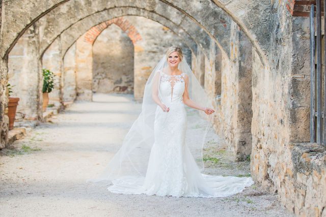 Jennifer's bridal with veil in the arches at Mission San Jose dancing