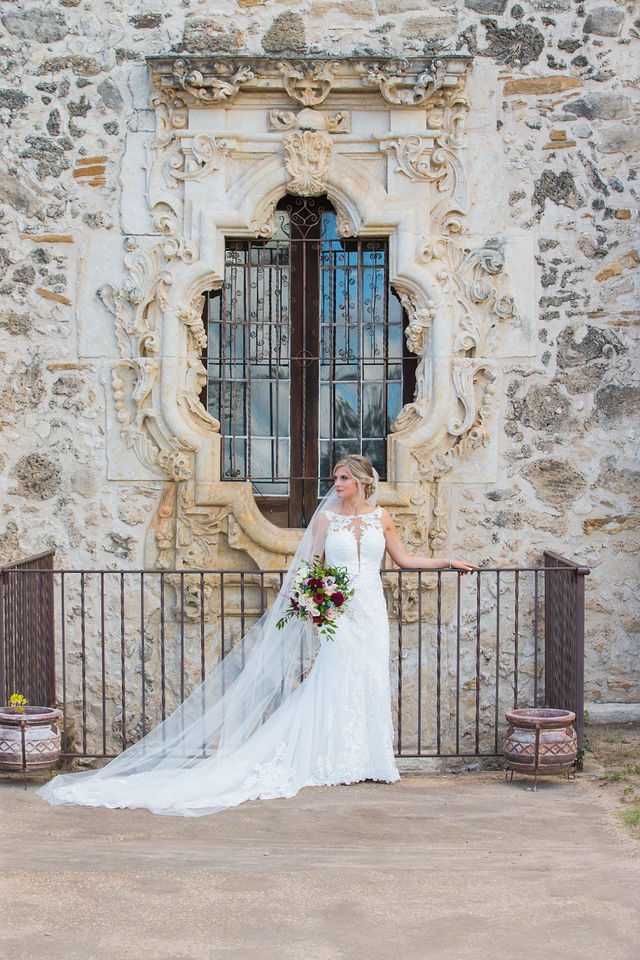 Jennifer's bridal at Mission San Jose outside the rose windows