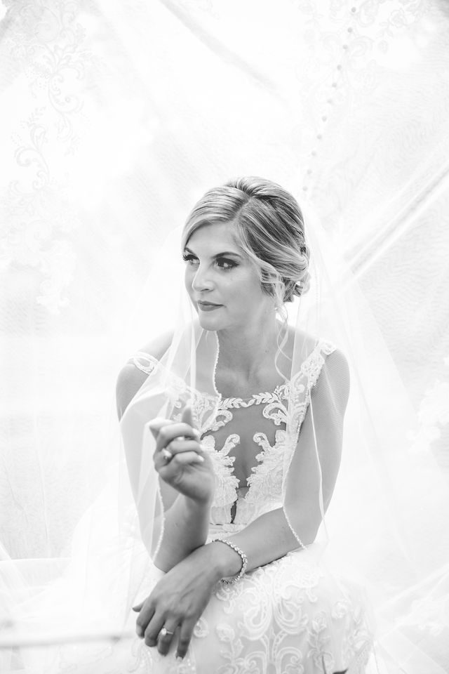 Jennifer's bridal at Mission San Jose portrait black and white with dress