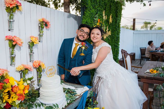 The Cruz-Martinez wedding in San Antonio reception cake cutting