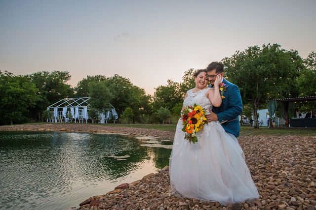 The Cruz-Martinez wedding in San Antonio reception sunset portrait by the lake