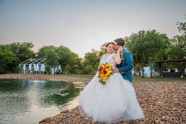 The Cruz-Martinez wedding reception in San Antonio sunset portrait by the lake