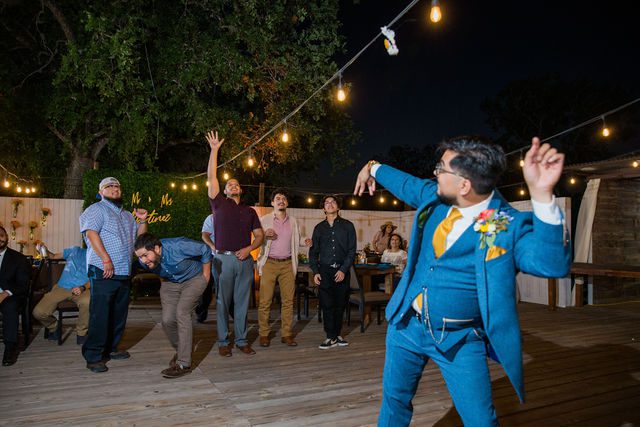 The Cruz-Martinez wedding reception in San Antonio garter toss
