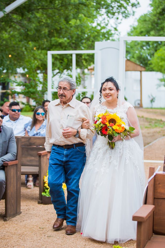 The Cruz-Martinez wedding in San Antonio the bride walking aisle