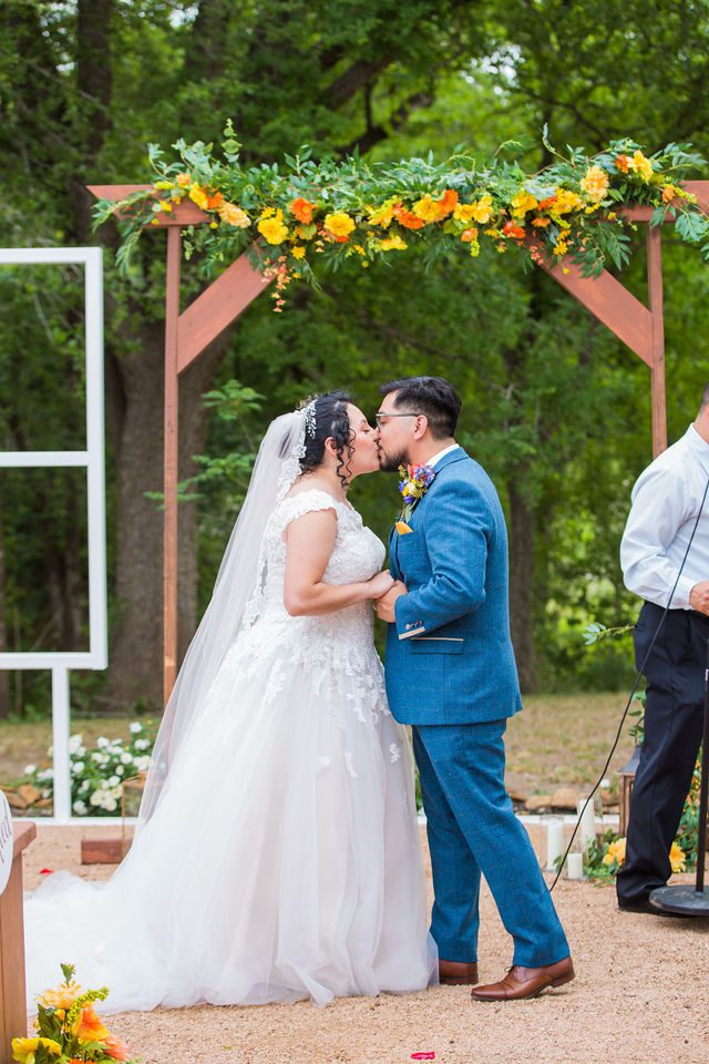 The Cruz-Martinez wedding in San Antonio ceremony kiss