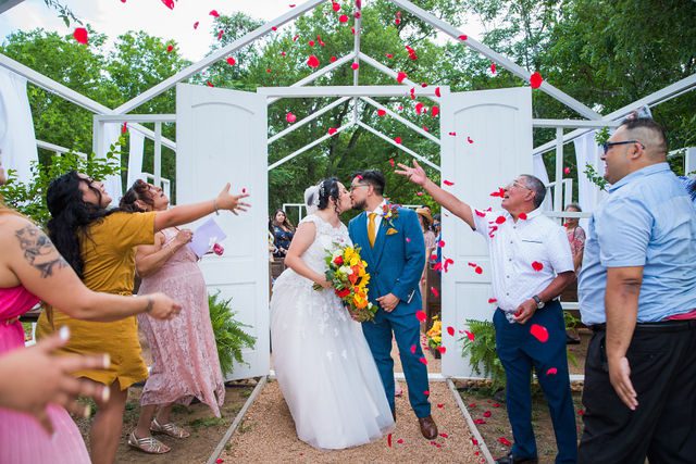 The Cruz-Martinez wedding in San Antonio ceremony exit with rose petals