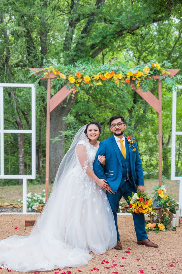 The Cruz-Martinez wedding in San Antonio couple portrait at arch