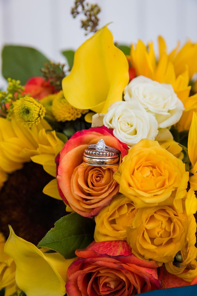 The Cruz-Martinez wedding in San Antonio reception the rings in flowers