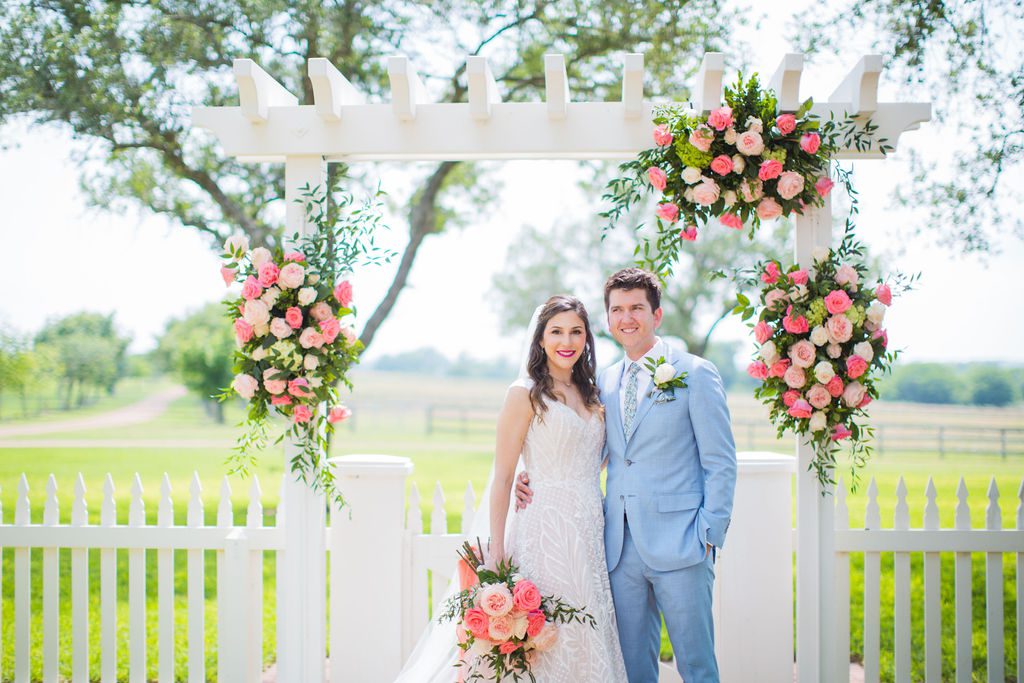 The Hamet wedding in San Antonio. The groom & bride portrait with flowers.