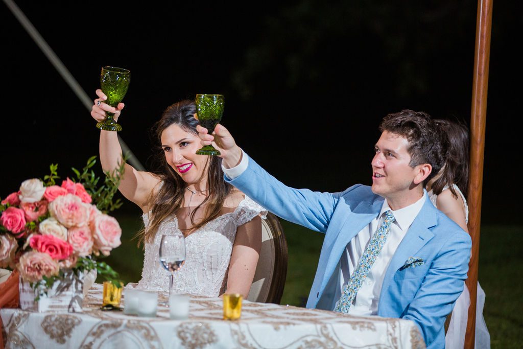 The Hamet wedding reception in San Antonio Hill country couple cheers