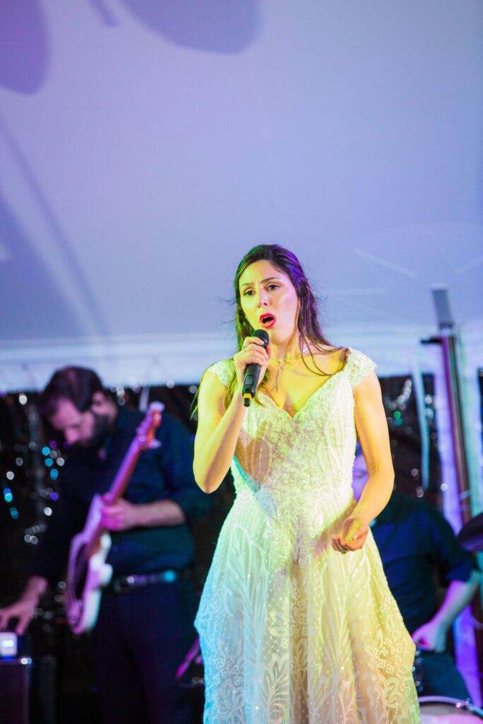 The Hamet wedding reception in San Antonio Hill country bride sings