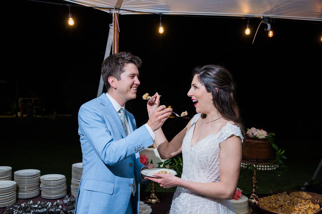 The Hamet wedding reception in San Antonio Hill country cake feeding