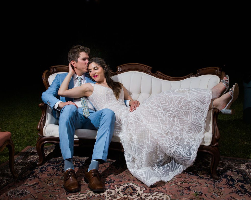 The Hamet wedding reception in San Antonio Hill country couple cuddle on couch