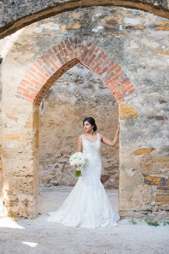 Sonali's bridal session in the doorway arch of Mission San Jose