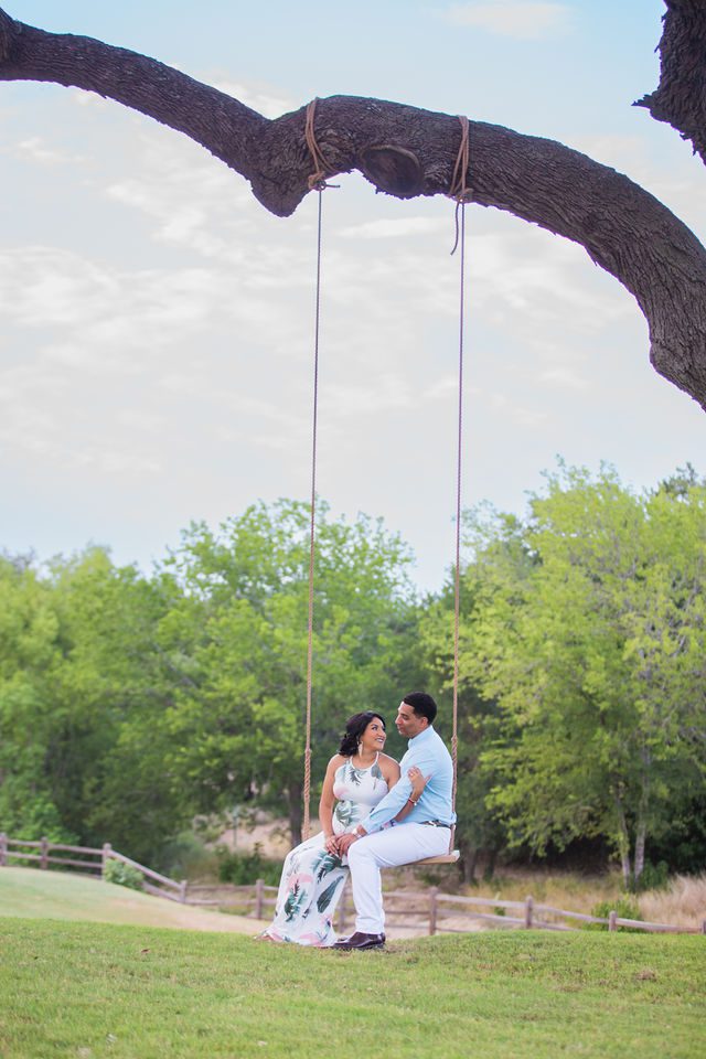 Jo Marie Engagement session Olympia Hill on the swing looking at each other