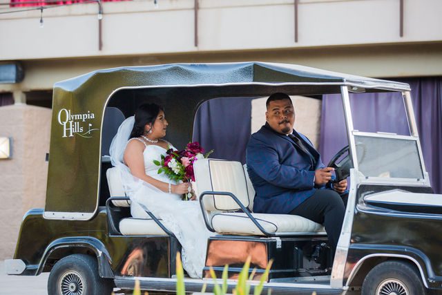 Jo Marie's wedding at Olympia Hills the bride on the golf cart