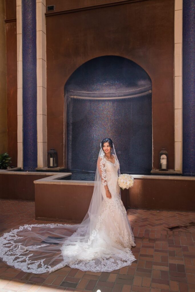 Sonali wedding Hotel Valencia San Antonio bride in the courtyard fountain