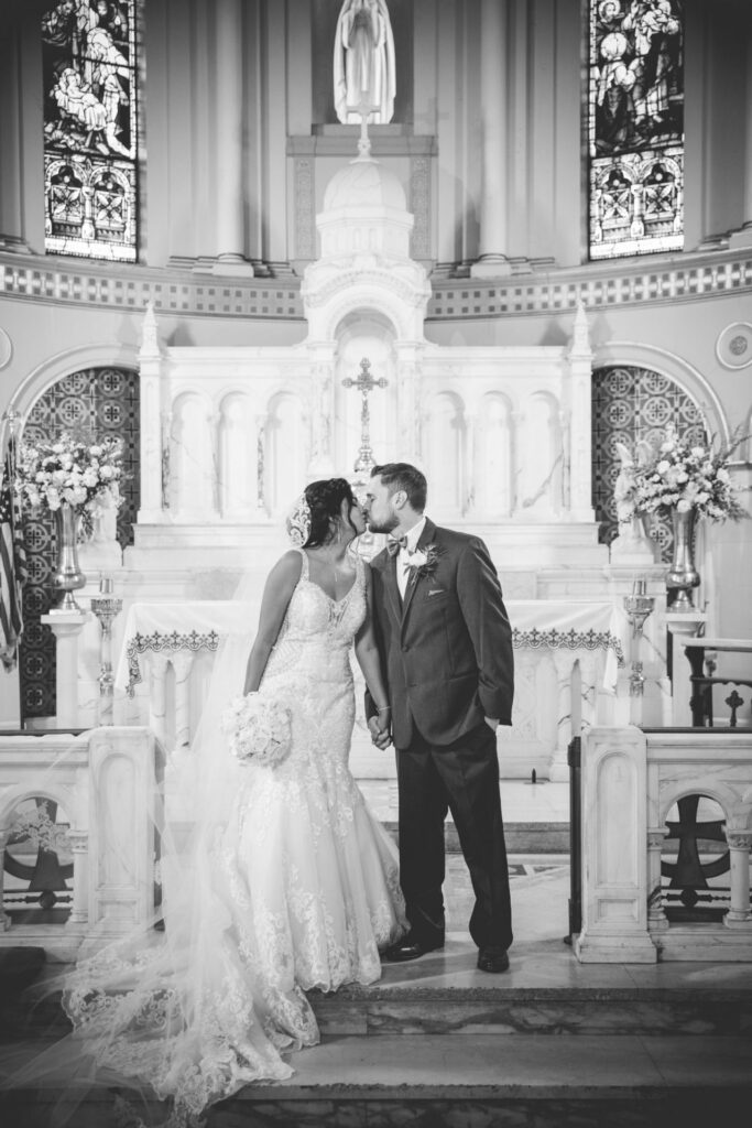 Sonali's wedding in San Antonio. The couple at St Mary's catholic church in black and white.