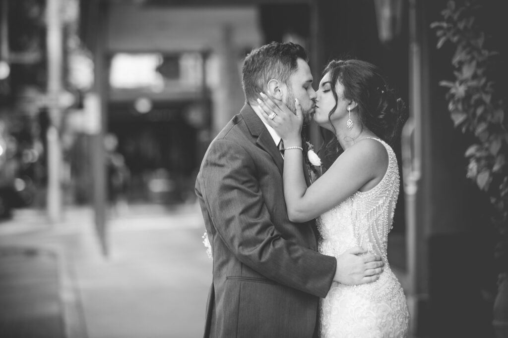 Sonali's wedding in San Antonio at hotel Valencia on the street kiss