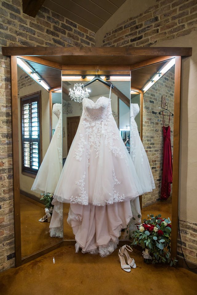 Hall wedding Chandelier of Gruene the gown hanging with bouquet