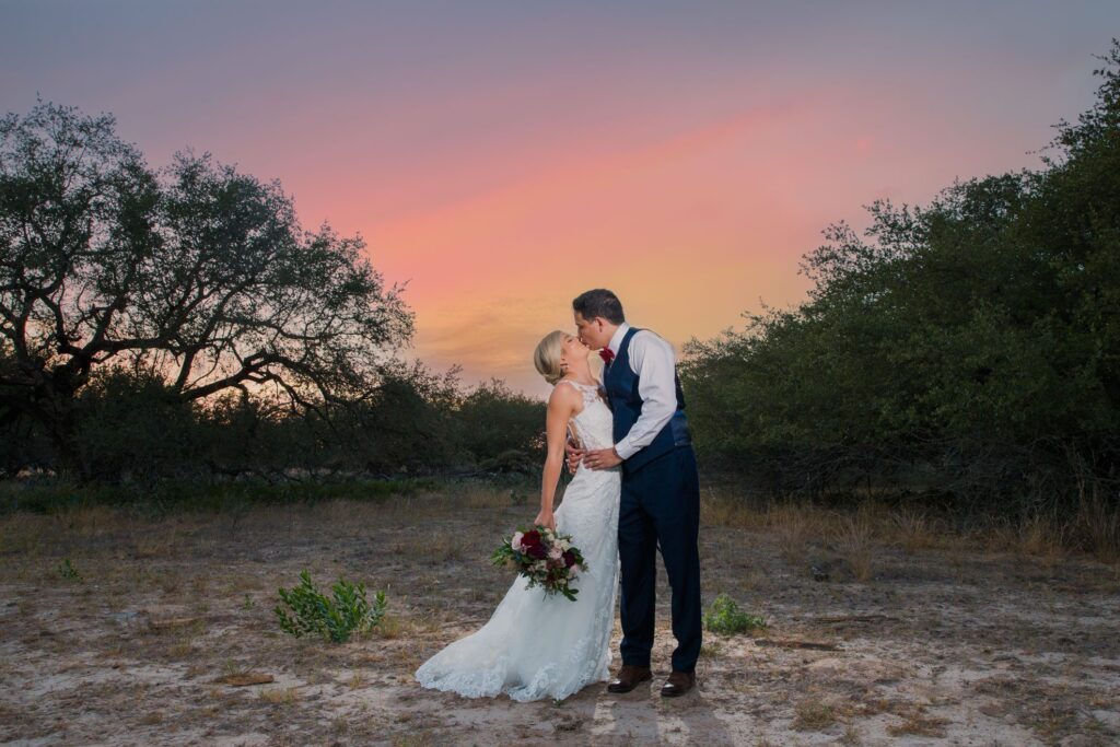 Ruiz wedding at Sandy Oaks Ranch sunset kiss portrait