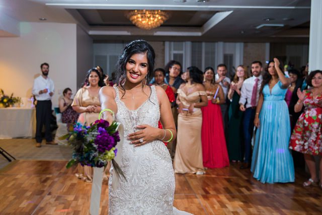 Sonali's wedding at Hotel Valencia reception bouquet toss