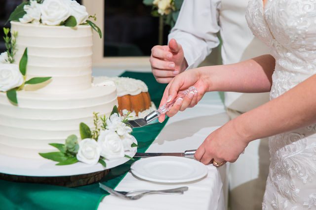Tate wedding reception at Olympia Hills cake cutting close up