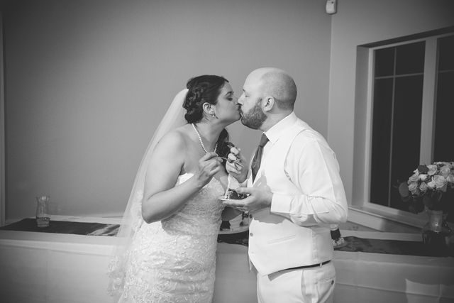 Tate wedding reception at Olympia Hills cake cutting kiss