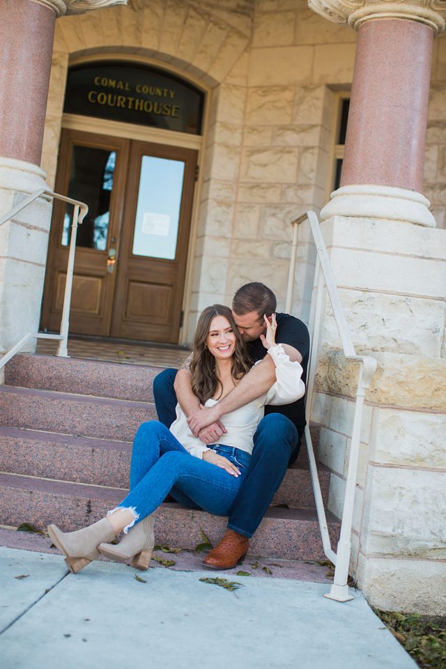 Schroeder's engagement sitting on the courthouse steps