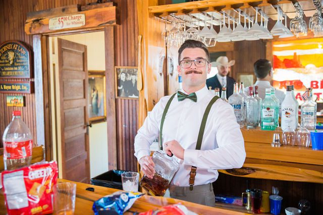 Lamm wedding at Eagle Dancer Ranch groomsmen bartender