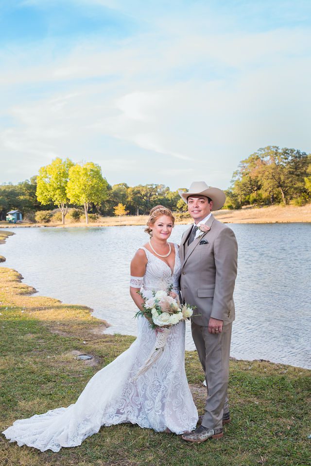 Lamm wedding at Eagle Dancer Ranch bride and groom at the pond