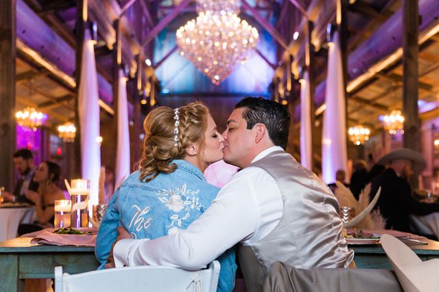 Lamm wedding reception at Eagle Dancer Ranch kiss at the head table