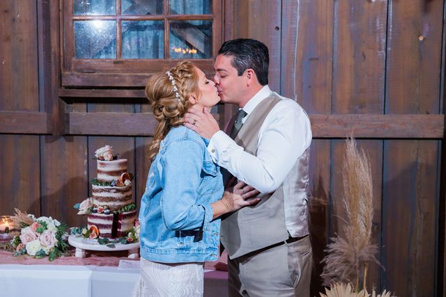 Lamm wedding reception at Eagle Dancer Ranch cake kiss